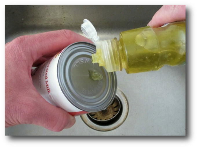 Adding a squirt of dish soap to a can top