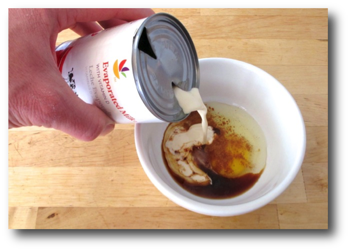 Pouring evaporated milk from a freshly opened can