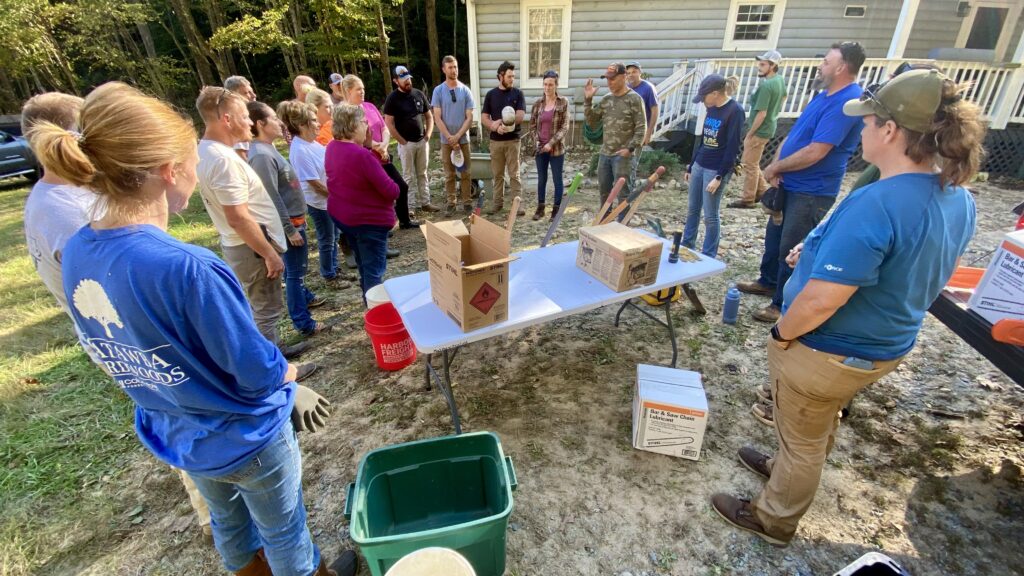 Crosspoint Church members with Elk Park homeowner, Viola, after cleaning Hurricane Helene damage on her property.