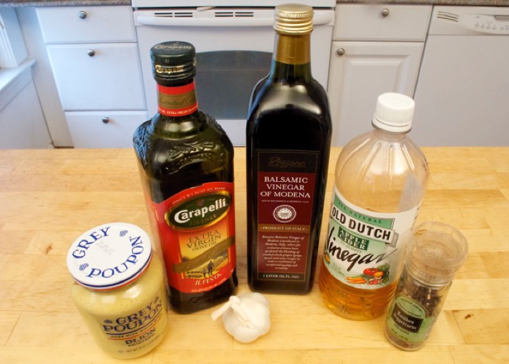 Ingredients needed to make 5-ingredient salad dressing with fresh garlic: fresh garlic, mustard, ground black pepper, olive oil and vinegar