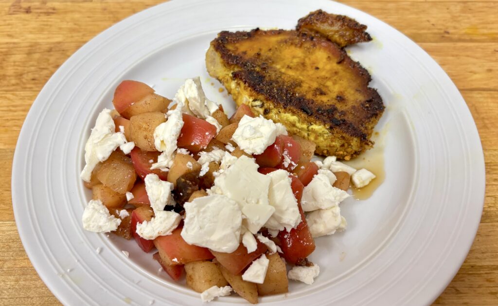 Warm feta cheese topped apple topping with pan cooked pork loin and link to the warm apple topping picture book recipe