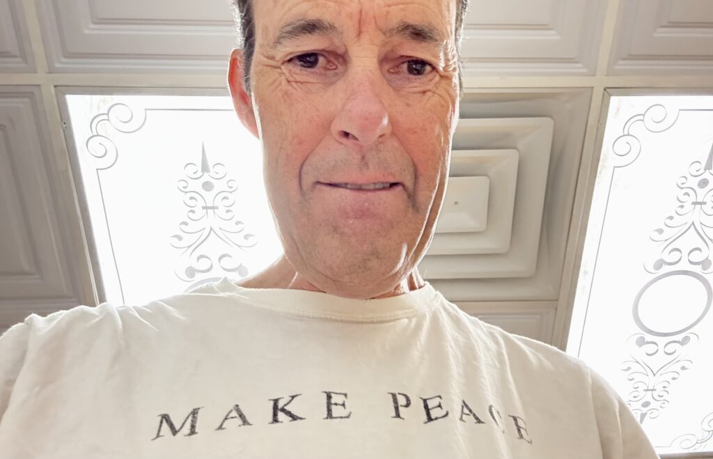 Bruce biting lip while focused on making breakfast.