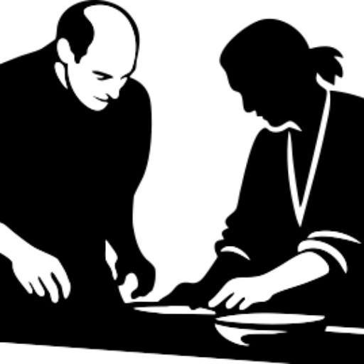 Silhouette of two people preparing food together.